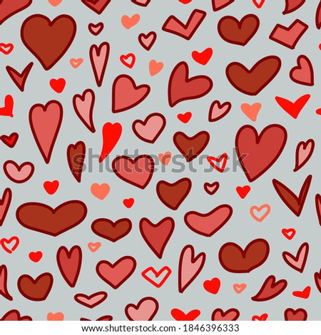 Seamless pattern. Pink and red Doodle-style hearts on a gray background. Vector.