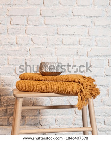Stack of clean soft towels on chair