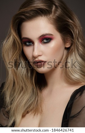 Fashionable portrait of a girl with bright makeup