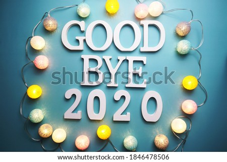 Goodbye 2020 alphabet letter with cotton ball LED decoration on blue background Royalty-Free Stock Photo #1846478506