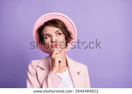 Photo of curly cheerful thoughtful cute lady dressed vintage outfit arm chin look empty space isolated purple color background