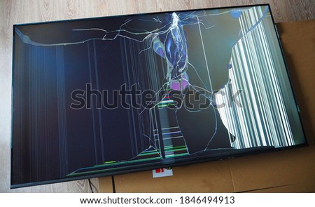 Broken led TV matrix. Damage to the screen of a modern TV as a result of impact or fall.
