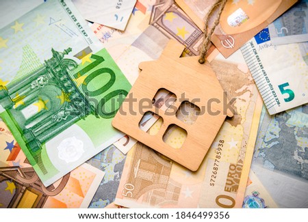 The symbol of the house lies on the background of the Euro