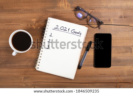 New Year's Solution Goal List 2021. Handwritten notebook about New Year's goals and resolutions plan list.