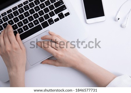 top view of female hands using laptop on desktop, work concept . High quality photo