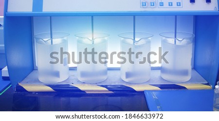 Wastwater Jar test (Coagulation test) from industry plant, Water quality test with blue light effect Royalty-Free Stock Photo #1846633972