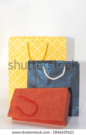 Hand made Paper Carry bags of various sizes and colors 
