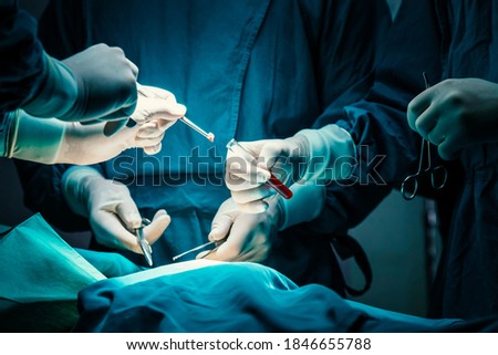 concentrated professional surgical doctor team operating surgery a patient in the operating room at hospital. tumor cancer. surgical biopsy specimens. healthcare and medical concept.
 Royalty-Free Stock Photo #1846655788