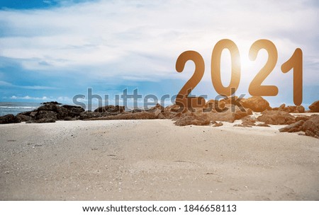 Happy new year 2021 on beach, sea and sky. Holiday concept.