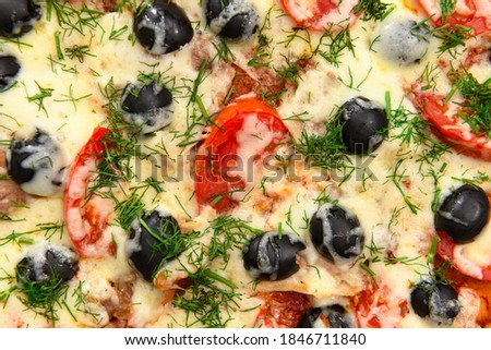 homemade pizza, vegetarian food, baked vegetables and cheese, tomatoes and olives, delicious food on a wooden background