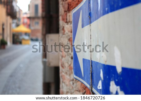 Street with road sign, arrow