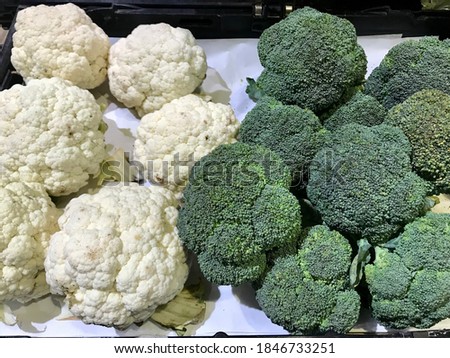 Fresh organic fresh cauliflowers with broccolis group for sale in the big fresh market center in Bangkok Thailand.Ingredient for cooking food and very good benefits and high vitamins for health eating
