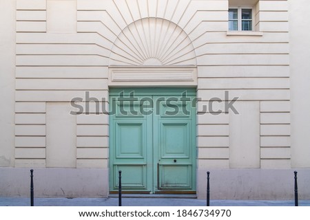 Paris, an old wooden door, typical building in the Marais