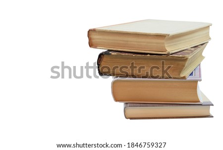 Four books laid out in a pile with a slight shift relative to each other