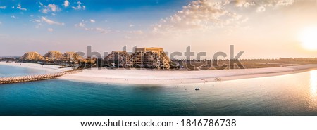 Marjan Island beach and waterfront in Ras al Khaimah emirate in the UAE aerial panoramic view at sunset Royalty-Free Stock Photo #1846786738
