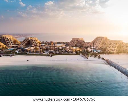 Marjan Island beach and waterfront in Ras al Khaimah emirate in the UAE aerial view at sunset Royalty-Free Stock Photo #1846786756