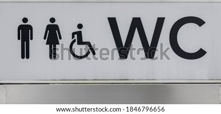 Public toilet sign board, Outdoor restroom and facility for handicapped and all genders, WC whiteboard in the urban park. 