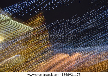 Abstract background of blurred colorful movements of led lamps, dark and Golden background.