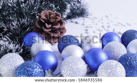 pine cone with blue and silver Christmas balls
