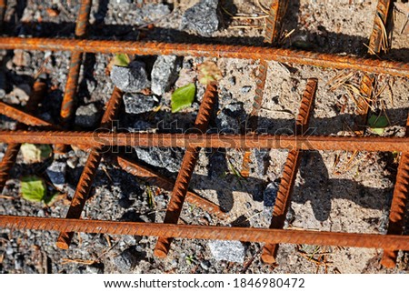 rusty rebar lying on the ground