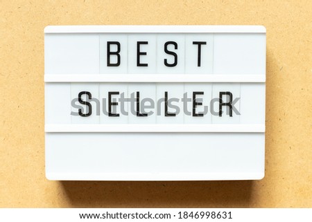 Lightbox with word best seller on wood background