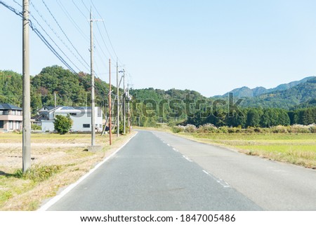A straight road in the Japanese countryside