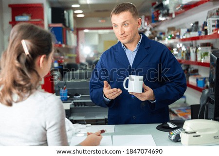 Positive administrator typography offers white mug for drawing picture. High quality photo
