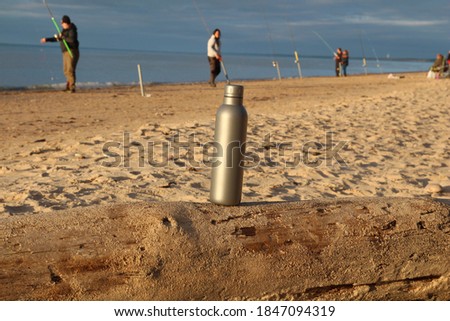 Baltic sea in Jurkalne, Latvia. Sea fishing on coast. Silver water Bottle. 