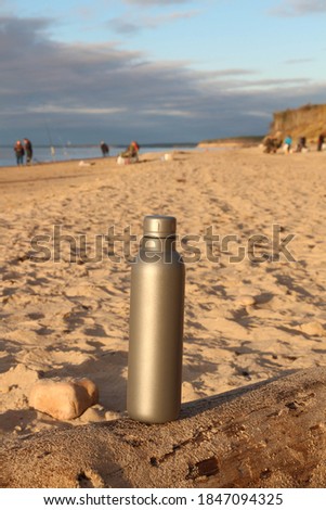Baltic sea in Jurkalne, Latvia. Sea fishing on coast. Silver water Bottle. 
