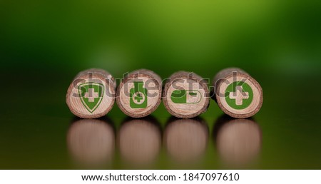 Concept of natural medicine with icons on wooden logs