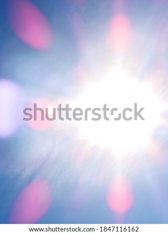 The sun flare effect as a camera shot is taken directly towards the sunlight.