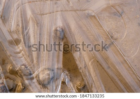 Ice pattern on a sandy beach