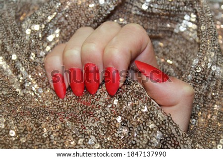 Nail Polish. Art Manicure. Modern style red Nail Polish. Stylish trendy female manicure. Beautiful young woman's hands