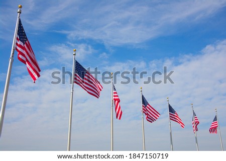 US national flags in blue sky