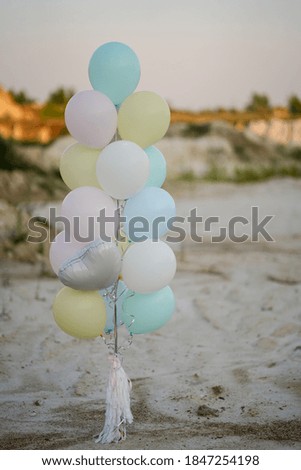 balloons of delicate colors on a light background holiday birthday tenderly