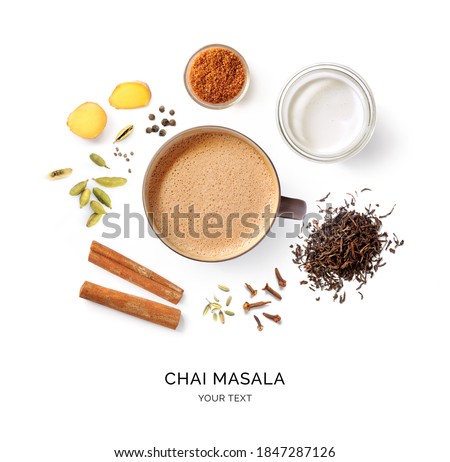 Creative layout made of chai masala on a white background. Top view. Indian drink. Black tea with milk and species.  Royalty-Free Stock Photo #1847287126