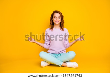 Full size photo positive inspired girl sit legs crossed folded enjoy fitness yoga exercise show om symbol meditate wear pink teal pants jumper isolated shine color background