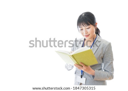 Young business person reading a book