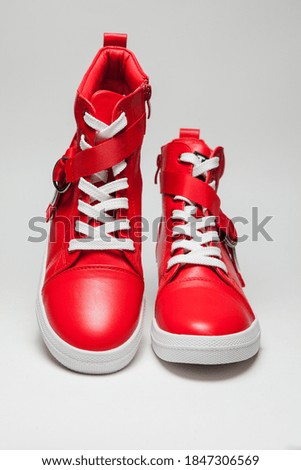 Red autumn leather shoes on white background