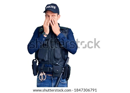 Young handsome man wearing police uniform rubbing eyes for fatigue and headache, sleepy and tired expression. vision problem 