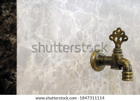 Photo of brown architectural fountain with marble finish
