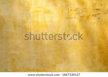 Yellow Grunge Vintage Wall Background with Light Beam.
