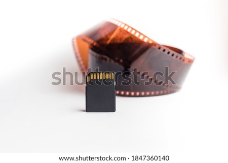 old film and modern flash card on white background. Progress and development concept