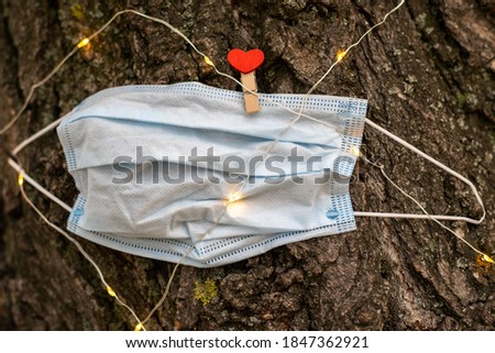 Medical mask on a tree with gerunda