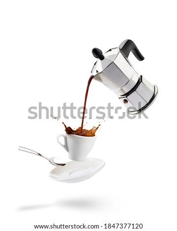 pouring coffee into cup from coffeepot with splashing Royalty-Free Stock Photo #1847377120