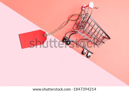 Supermarket trolley with a price tag. Discounts concept. Sale.