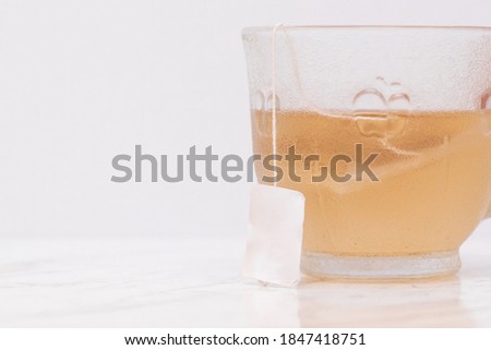 cup of passion fruit tea on marble table