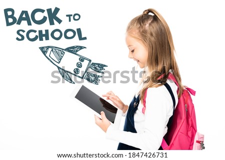 side view of schoolgirl holding digital tablet with blank screen isolated on white, back to school illustration