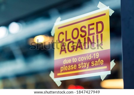 window store glass door entrance handing closed sign shop again from covid-19 spread and lockdown 2nd announcement from goverment health and quarantine concept