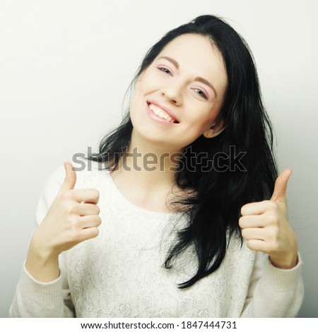 Young Woman Showing Thumb Up